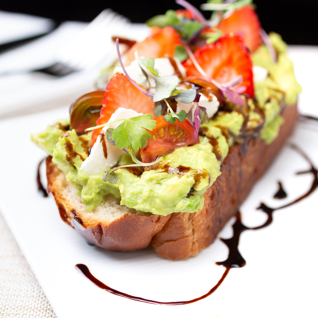 Avo and Tomato on thick toast with Jomeis Sweet Balsamic Reduction