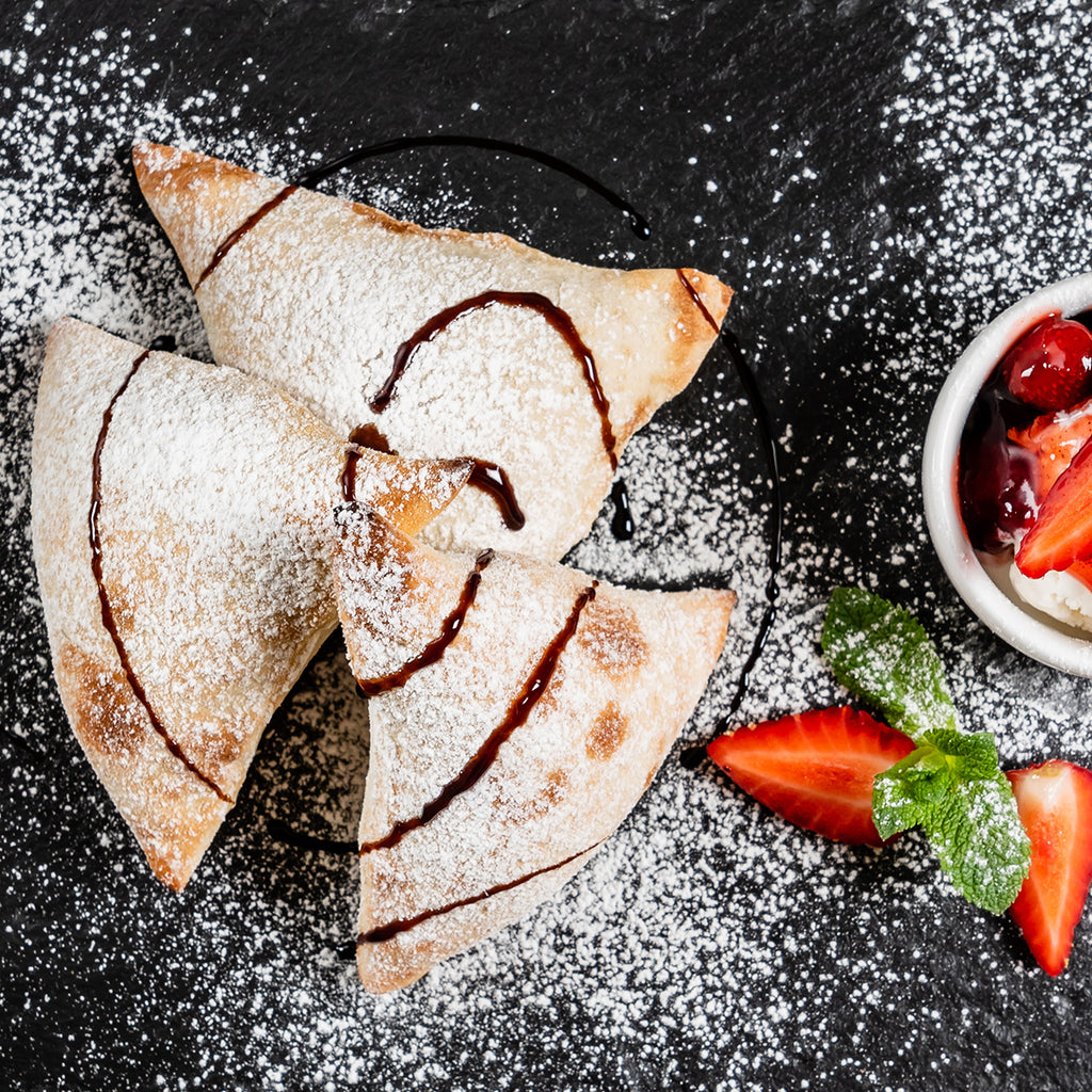 Italian cake with ice cream,  strawberries and Jomeis Sweet Balsamic Reduction