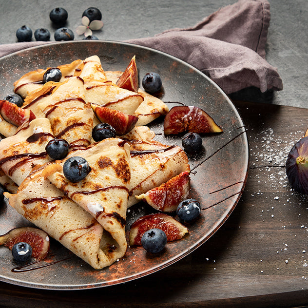 Jomeis Sweet Balsamic Reduction drizzled over crepes with blueberries and figs